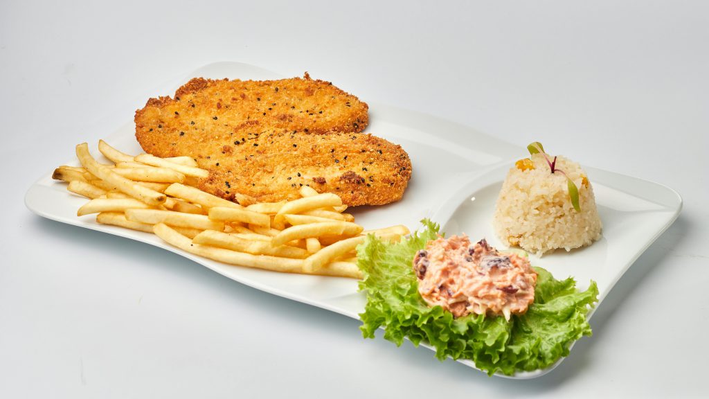 Delicious crispy fried fish with golden fries, rice, and salad on a plate.